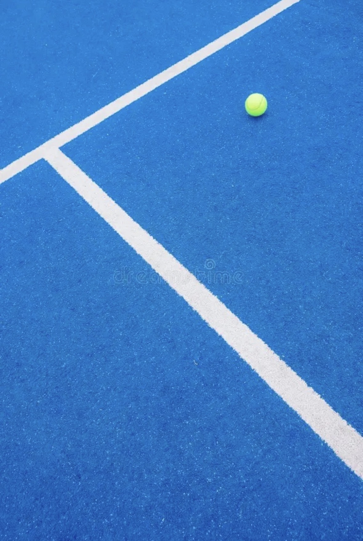 Tennis player mid-swing on clay court